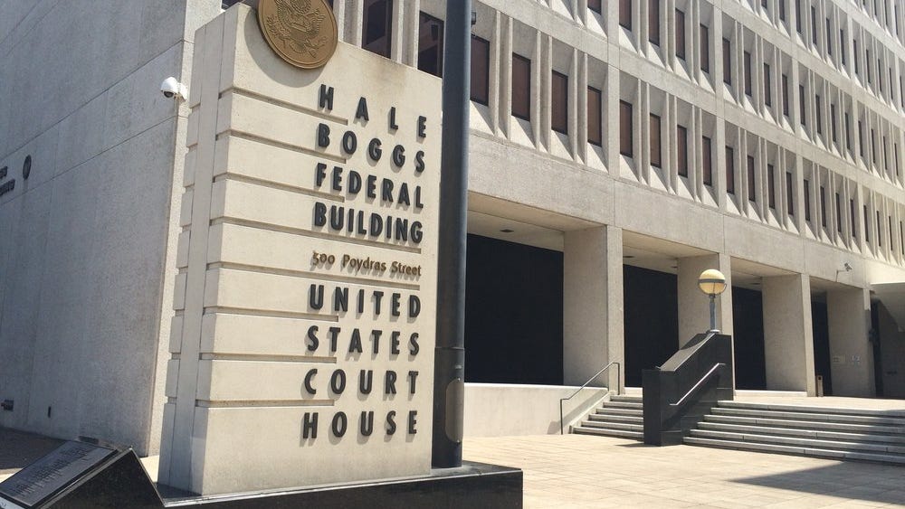 Strain pleads guilty to single federal bribery count