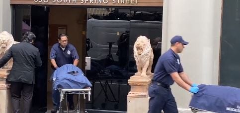 officers rolling out body bags