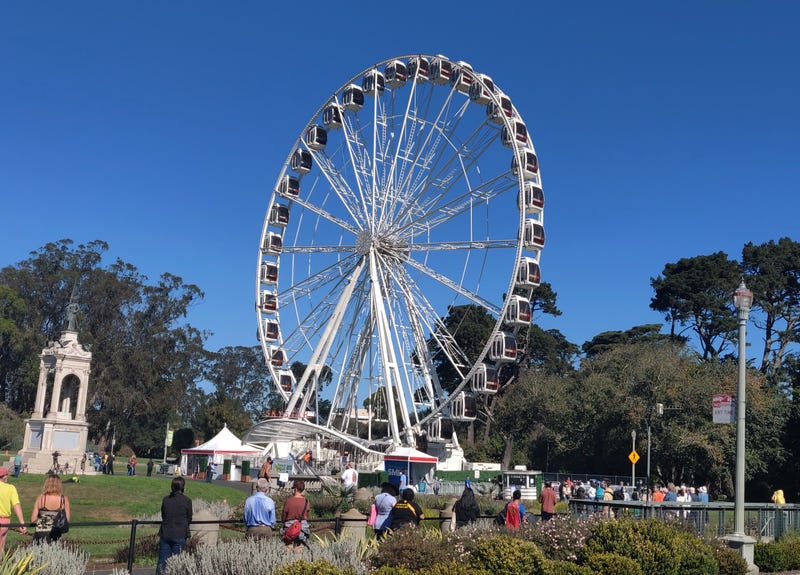 The opening day line stretches well beyond the SkyStar Observation Wheel.