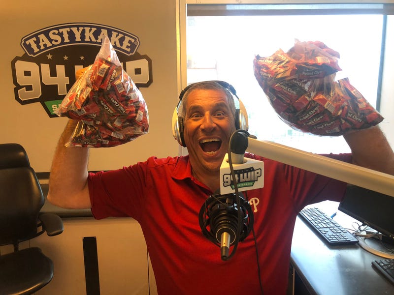 Angelo Cataldi holding bags of Peanut Chews.
