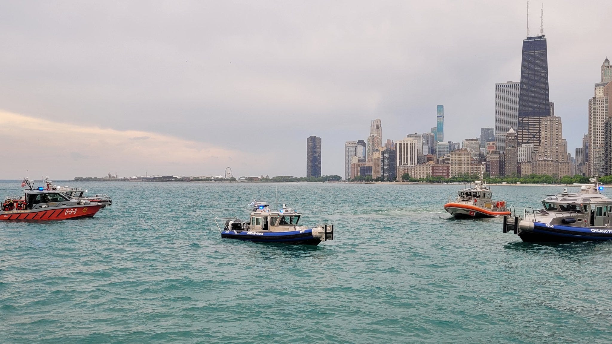 Rescue teams save 9 from sinking boat on Lake Michigan