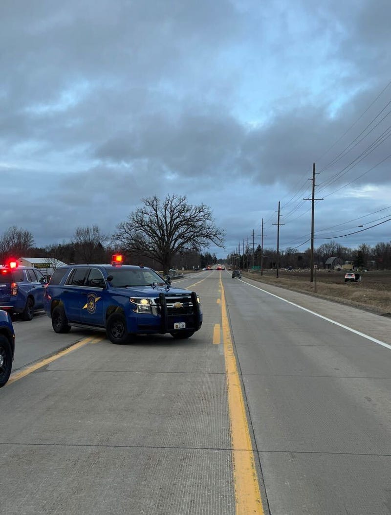 MSP vehicles with white vehicle off the road in the background