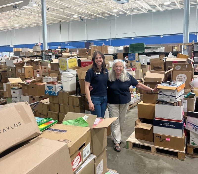 Kay McKeen, right, the founder of SCARCE in Addison, poses for a photo inside of the 18,900-square-foot space, which serves as a place to recycle and repurpose items for use in local schools and the community.