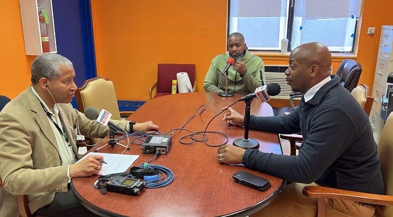 WBBM Political Editor Craig Dellimore, left, interviews Gregory Matthews, center, and Garien Gatewood, right, about Mayor Brandon Johnson's plan to combat violence in Chicago this summer.