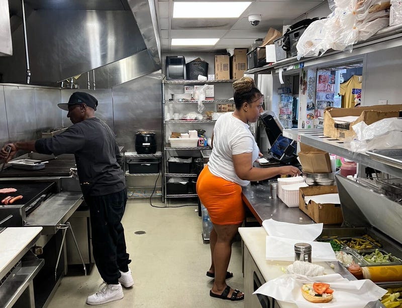 Toni Morris takes an order from a customer at the Wiener's Circle. She said customers should have fun when they come to the Lincoln Park hot dog stand. "Let loose," she said. "Curse us back. Don't be scared."