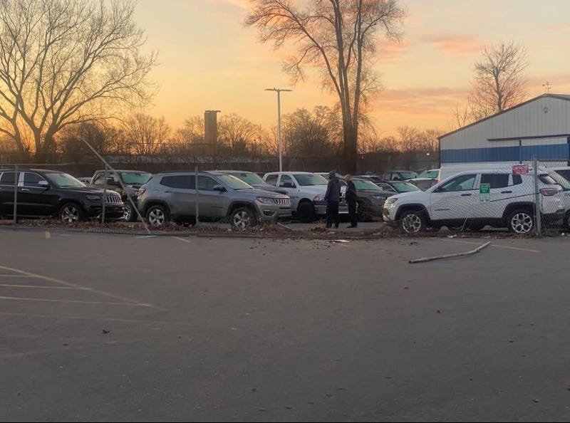 Dealership with broken fence
