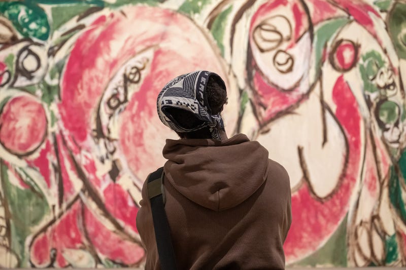 A visitor at the Whitney Museum during a free admission night.