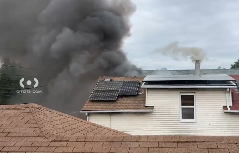 Citizen App footage shows heavy smoke spilling out a home in Clason Point on Friday.
