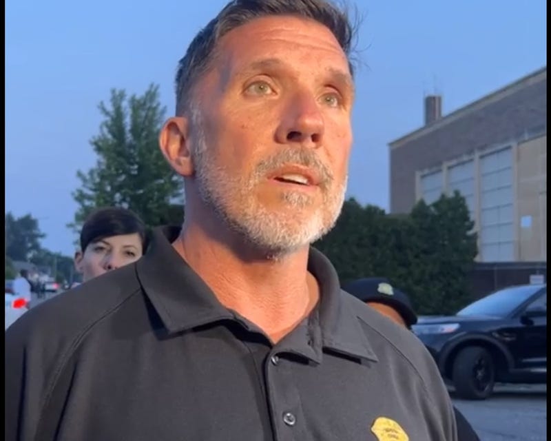 Assistant Detroit Police Chief Charles Fitzgerald speaks to reporters.