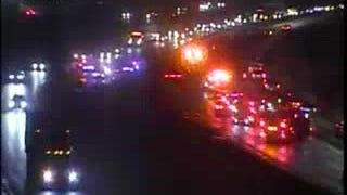 WB I-696 completely closed, 2 EB lanes blocked after semi truck slams into median wall, scatters load across freeway