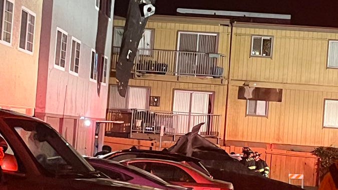 High winds tear the roof off an apartment building in South San Francisco