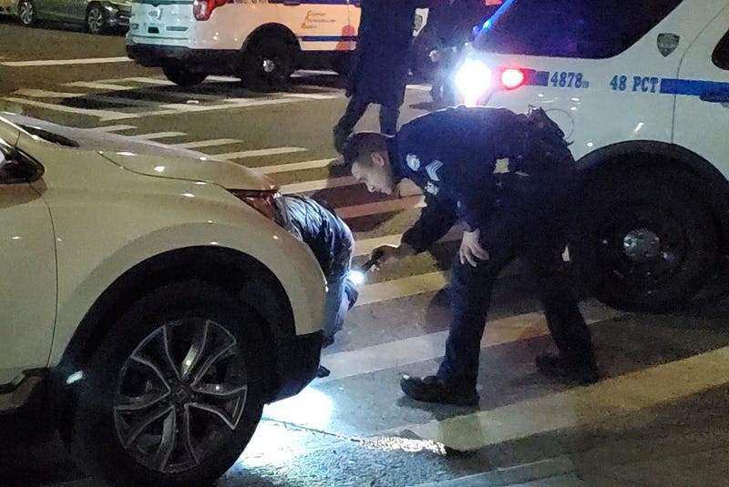 Police investigate at the scene of the shooting