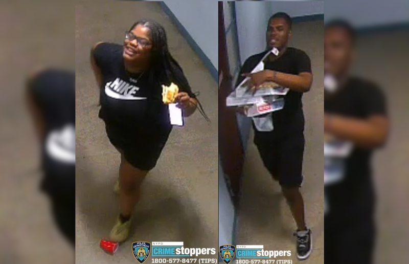 Cops are searching for two suspects, who appear to be eating and carrying Domino's pizza in surveillance images