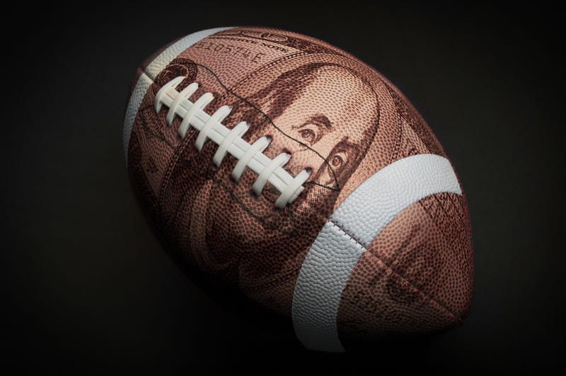 Football with Money imprinted on it