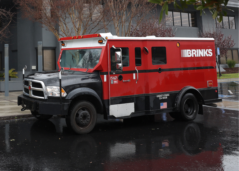 Brink's armored truck guard robbed at gunpoint in Reseda; unknown amount of money stolen