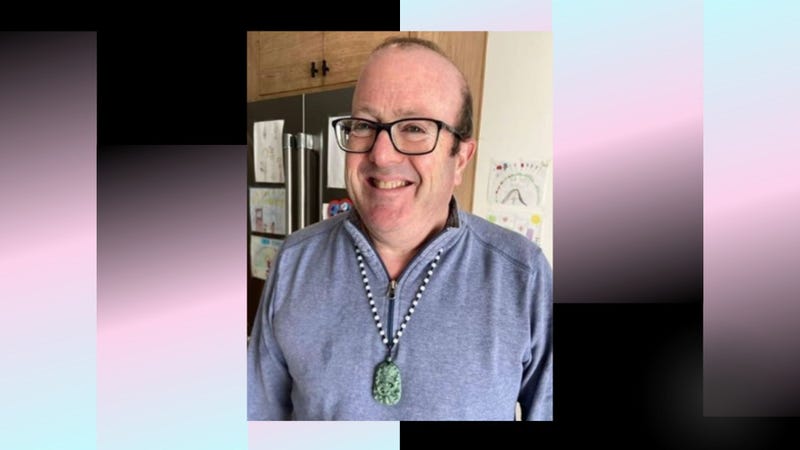 white man with balding dark hair and glasses