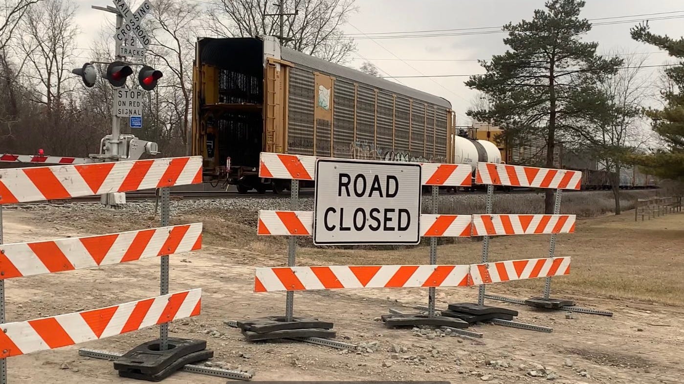 Clean up efforts continue after trains collide in western Wayne County, derailing 2 cars