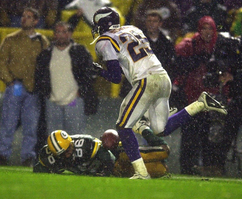 The football dropped by Vikings cornerback Cris Dishman hits the arm of Green Bay Packers Antonio Freeman as he lies on the ground. Freeman retained control of the ball, picked it up and ran for a touchdown to give the Packers a 26-20 win against Minnesota Nov. 6, 2000. Antonio Freeman Packers Vs Vikings