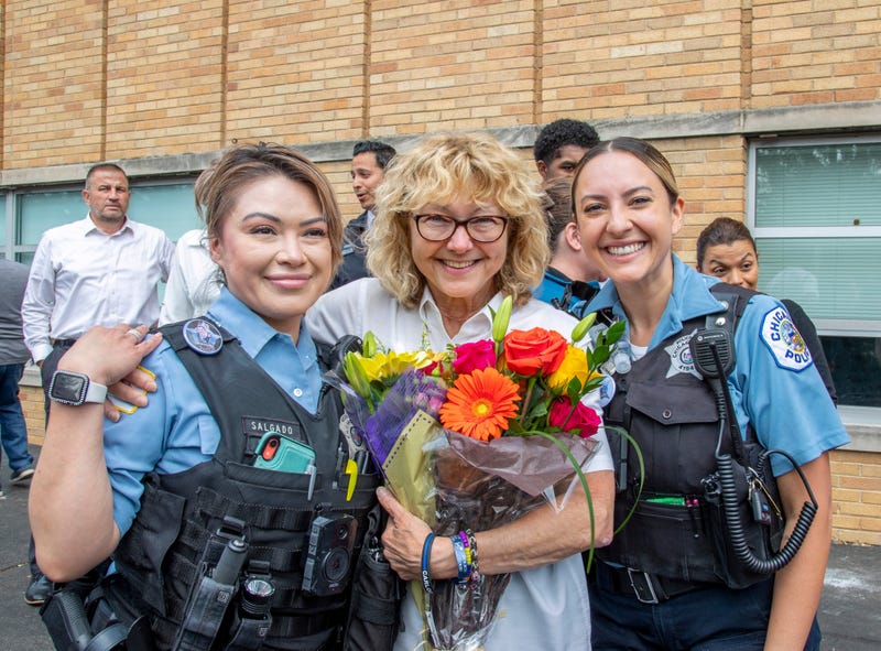 Slain cop's mother with two officers