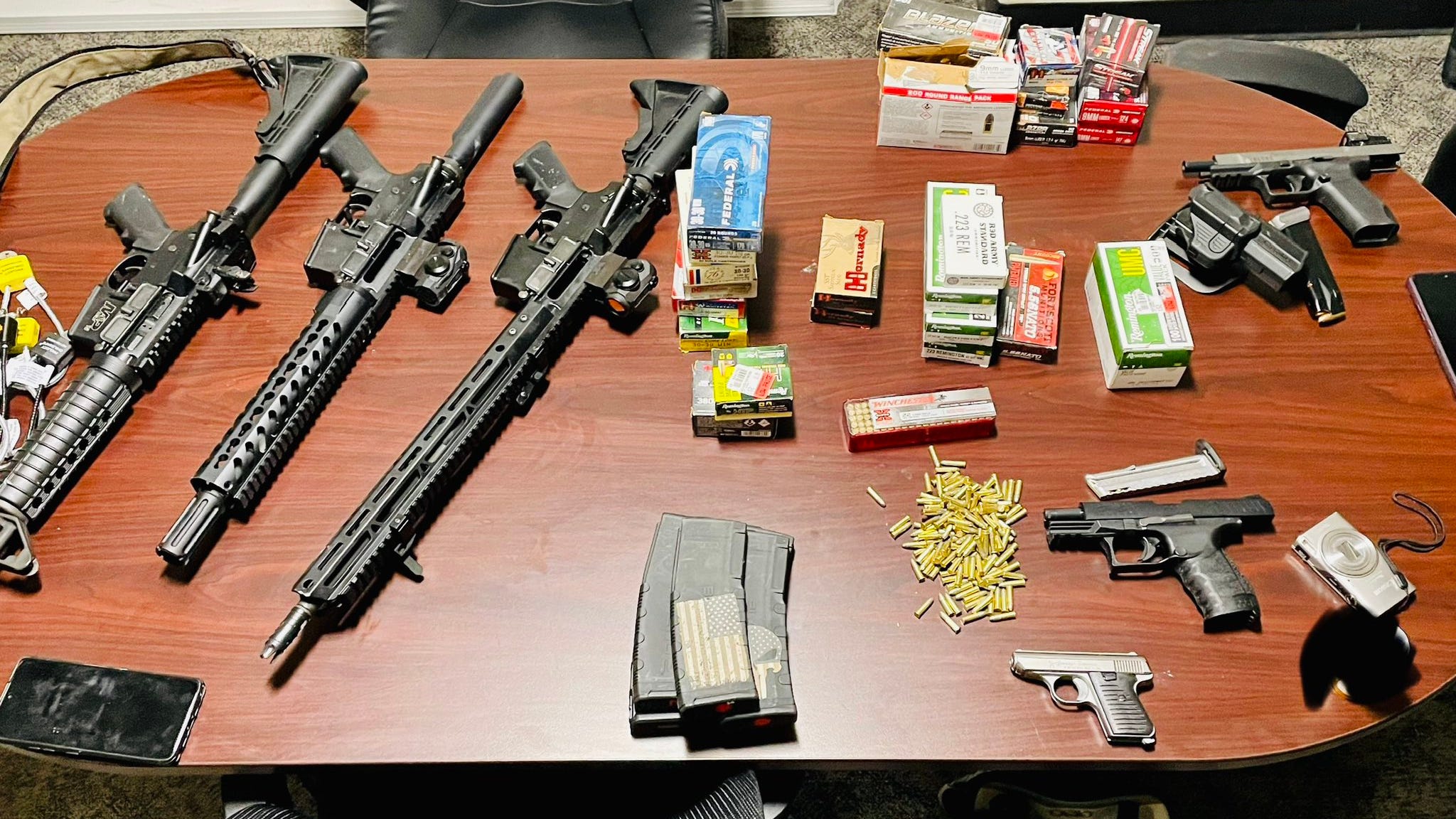 Monroe officers responding to gunfire discover 2 suspects with stolen weapons & ammunition