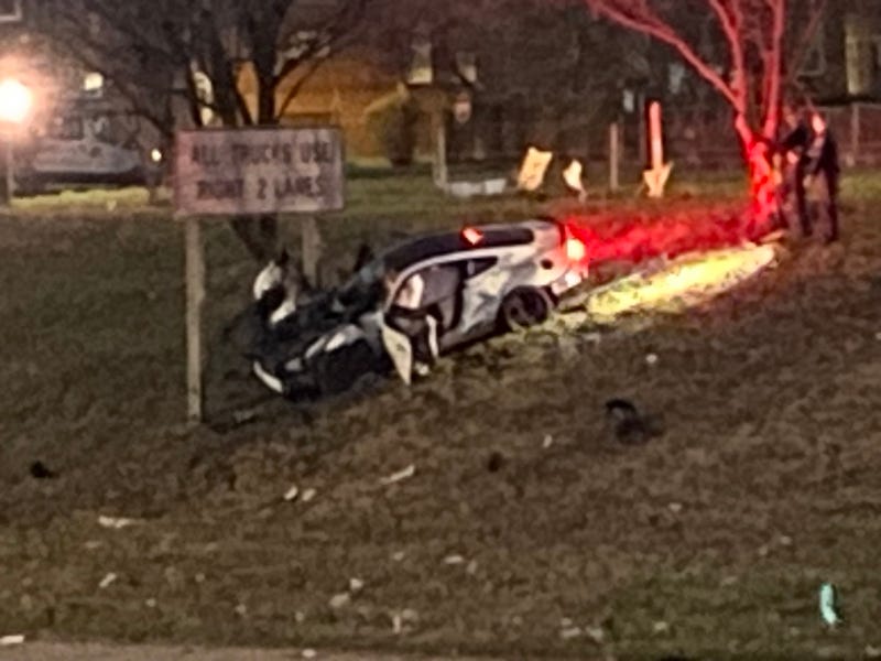  A section of Jeffries Freeway is closed early Wednesday morning after a white sportscar crashed and burst into flames