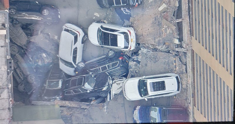 Vehicles are seen piled on top of each other at the scene of the collapse Wednesday morning