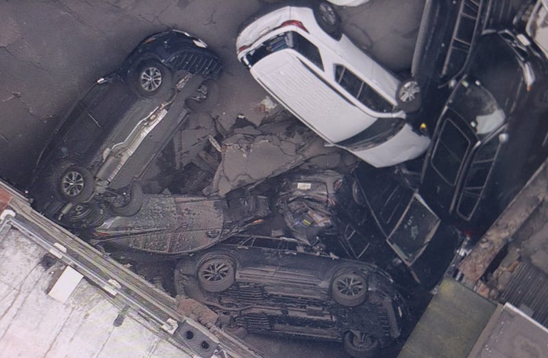 Damaged vehicles are seen piled up Wednesday at the Ann Street parking garage