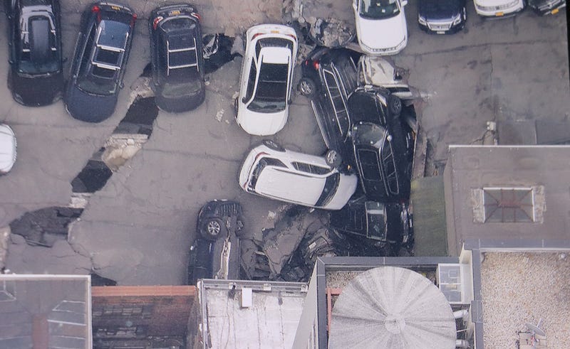 Vehicles plunged into a hole as the three-story garage partially collapsed in seconds
