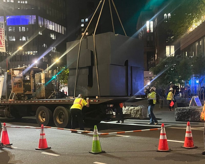 Crews secured The Cube on a flatbed truck Monday night so it could be taken to a foundry in Connecticut