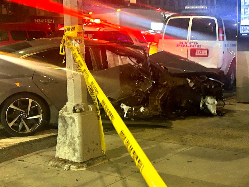 Two pedestrians on the sidewalk were run over by the right tires of the sedan, police said