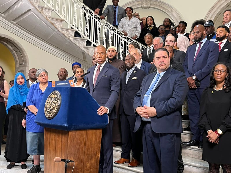 Mayor Eric Adams held a press conference with faith leaders at City Hall to announce a plan to house about 1,000 men at houses of worship