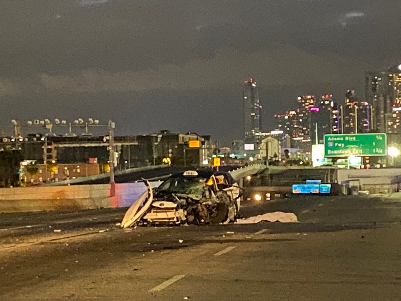 A wrong-way collision left a taxi driver dead and three others critically injured Friday morning.