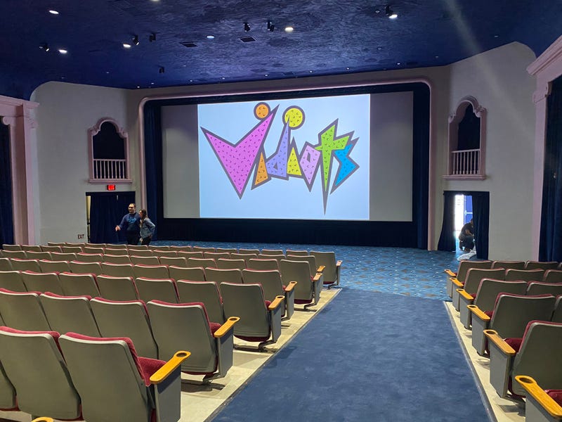 movie theater with vidiots logo on screen