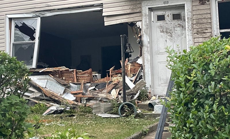 The car landed in a family's living room after launching off a retaining wall