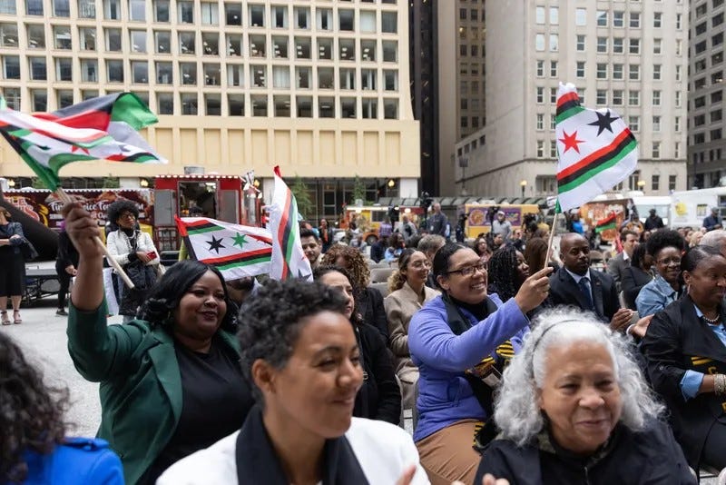 Chicagoans gather at Daley Plaza in June 2023 as Mayor Brandon Johnson and other civic leaders raise Chicago's Juneteenth flag.