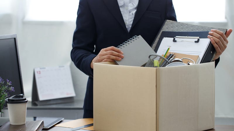 Woman fills cardboard box