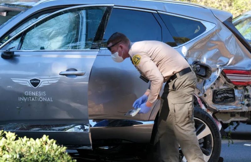 L.A. County Sheriff's investigator examining Genesis SUV that crashed with Tiger Woods inside.