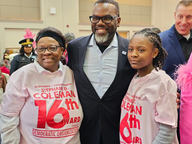 Mayor Brandon Johnson poses with attendees at an annual luncheon in Chicago's Englewood neighborhood. The event celebrates local veterans and seniors. One of them, Marvin Ware, said he and other veterans are still grappling with a number of unkept promises.