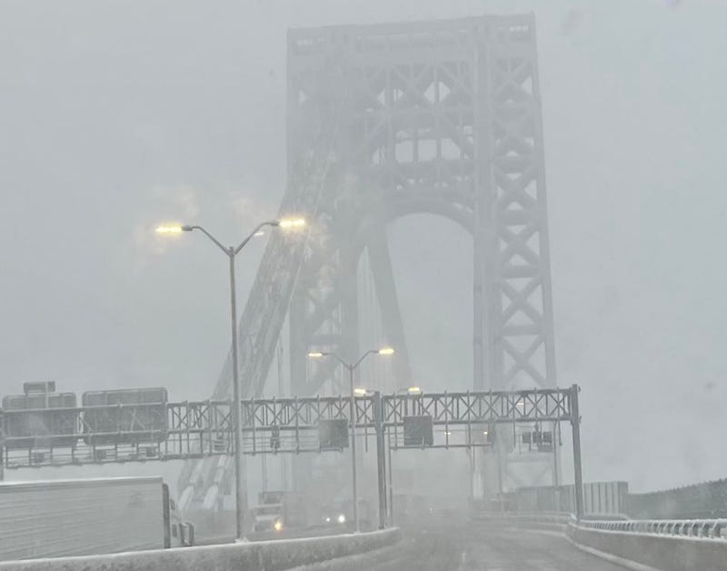 Snow falls on the George Washington Bridge on Feb. 13, 2024