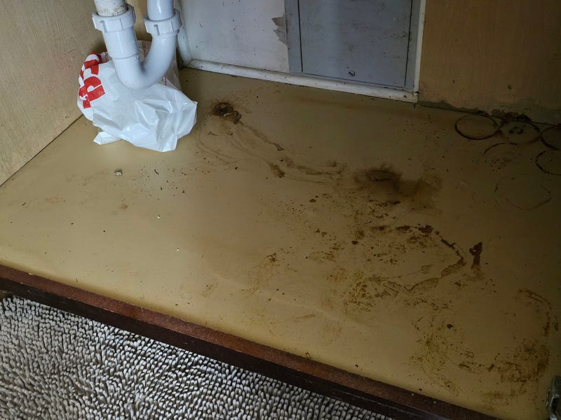 Water damage underneath a sink inside of a residence at the Chicago Housing Authority-operated Washington Park Homes. Residents said they're demanding a meeting with the CHA to get a reasonable timeline for repairs or relocation.
