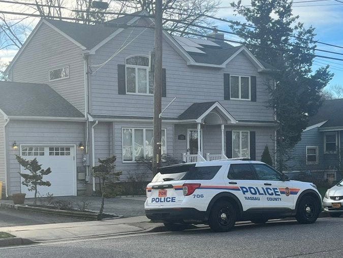 A Nassau County Police car is seen parked outside the home of fallen NYPD Officer Jonathan Diller on Tuesday