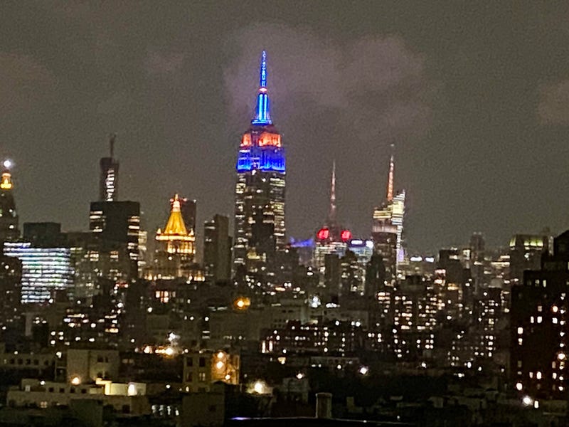 The Empire State Building shines in blue and orange for the Mets on Thursday night