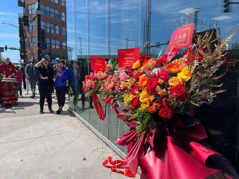 Floral arrangements set up outside of a new, no-appointment DMV that opened its doors in Chicago's Chinatown neighborhood on Monday.