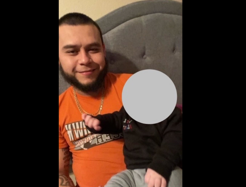 Victor Lucha, shown here with his son. In a federal lawsuit filed on behalf of Lucha and his wife Marisol Angel-Tapia, lawyers accused the Illinois Department of Children and Family Services of separating the 7-month-old infant from his parents unnecessarily. Per the family's request, WBBM Newsradio has hidden the infant's face in this photo.