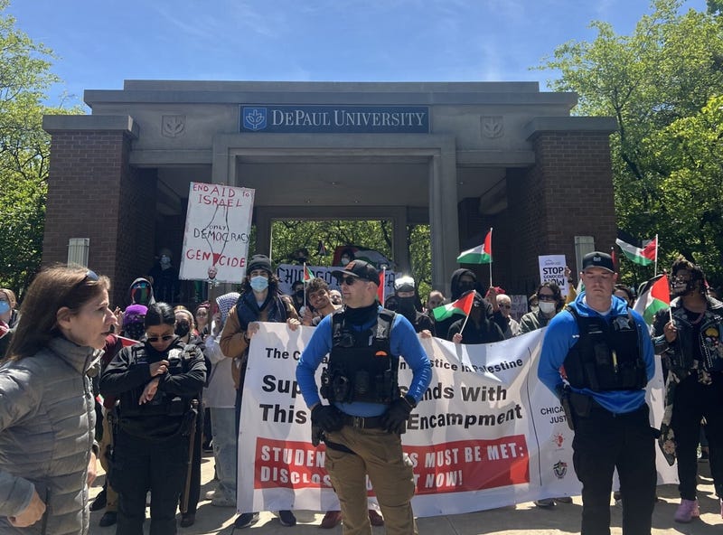 Demonstrators protesting the Israel-Hamas war gather at DePaul University on Sunday as Chicago police look on.