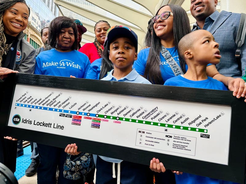 Idris Lockett, center, had his wish of being a CTA train operator granted on Monday.