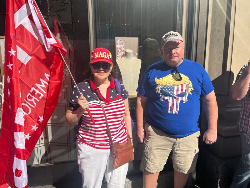 Trump supporters wave a Trump flag outside Trump Tower on Friday morning