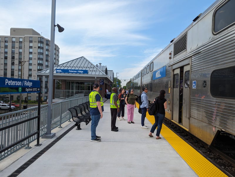 Metra station platform, with train on tracks