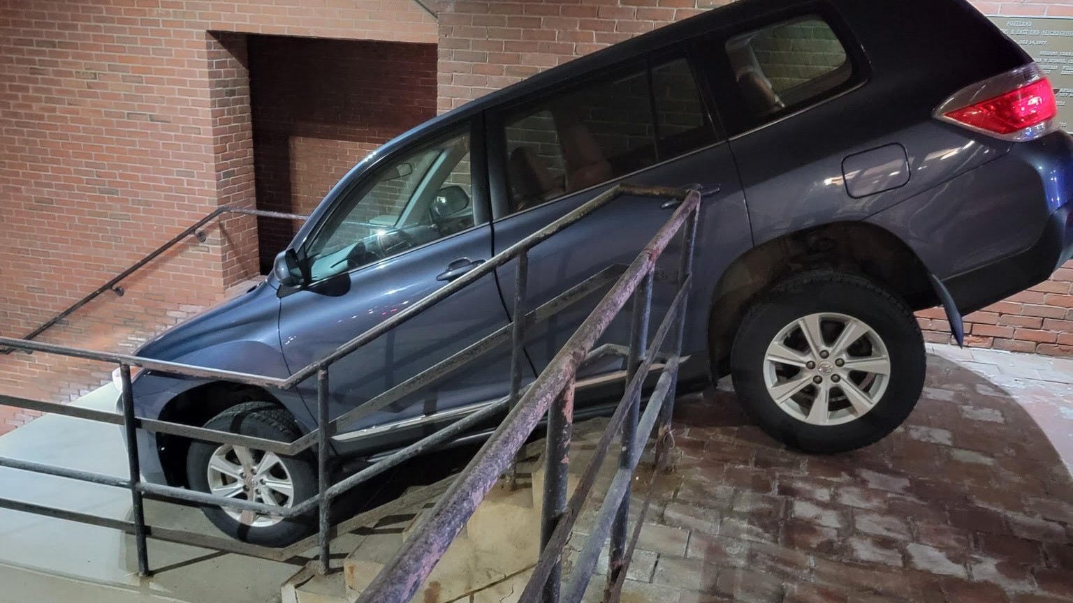 Woman follows GPS in her SUV down flight of stairs outside police station