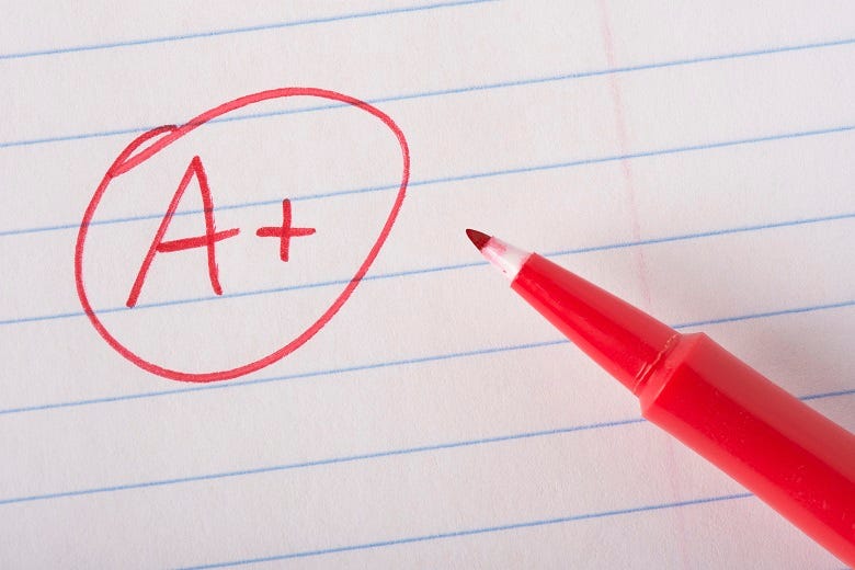 teacher's red pen giving an "A+"